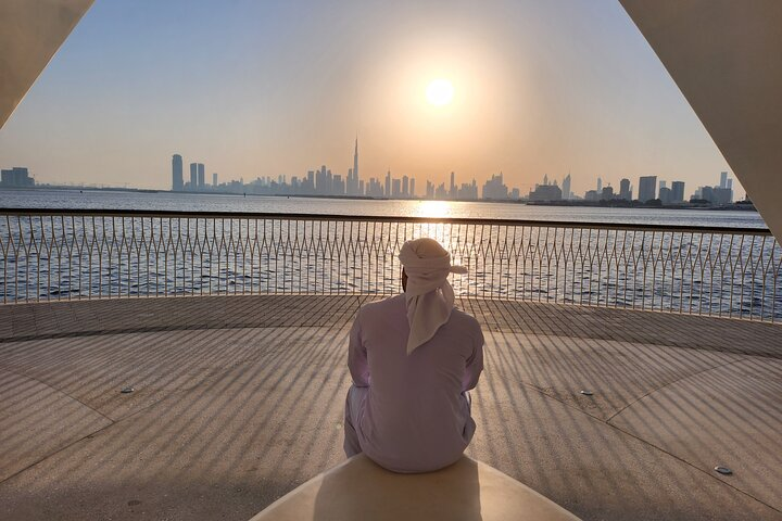 Witness the stunning skyline of Dubai at sunset where iconic landmarks like the Burj Khalifa and serene waters create a memorable backdrop for an unforgettable exploration of the city.